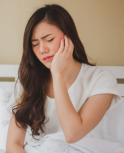 image of Asian woman feel terrible toothache