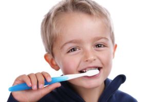 image of little boy burshing teeth